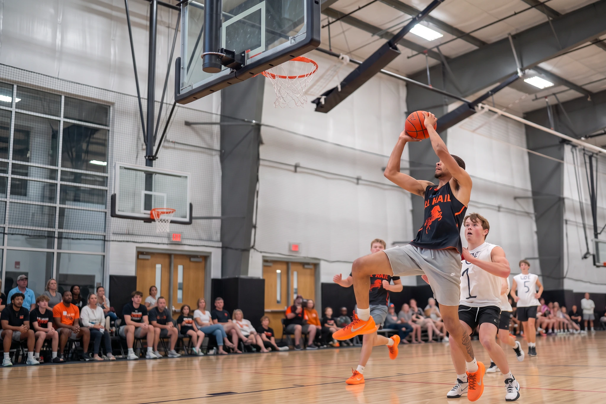 A basketball player rises for a layup at the WyoHoops Summer Showcase in Wyoming