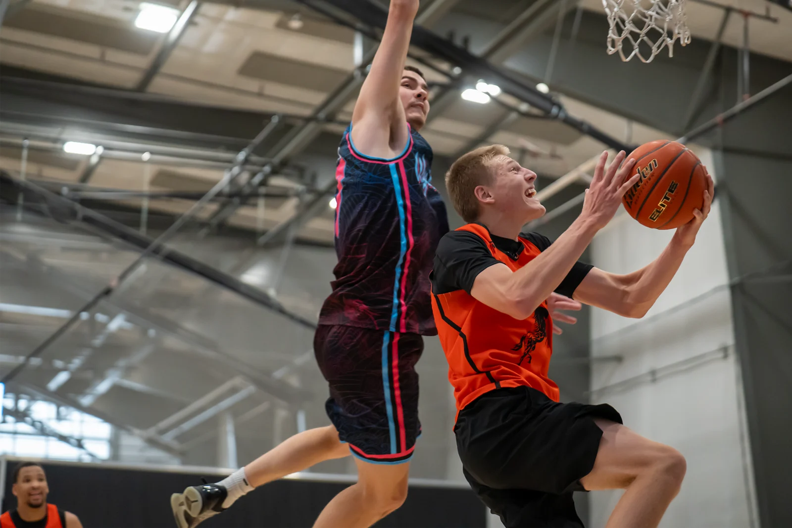 A Wyoming basketball player drives to the basket at the WyoHoops Summer Showcase